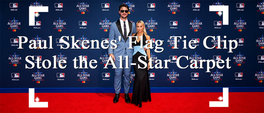 Paul Skenes wearing an American flag tie clip with a blue suit on the MLB All-Star red carpet