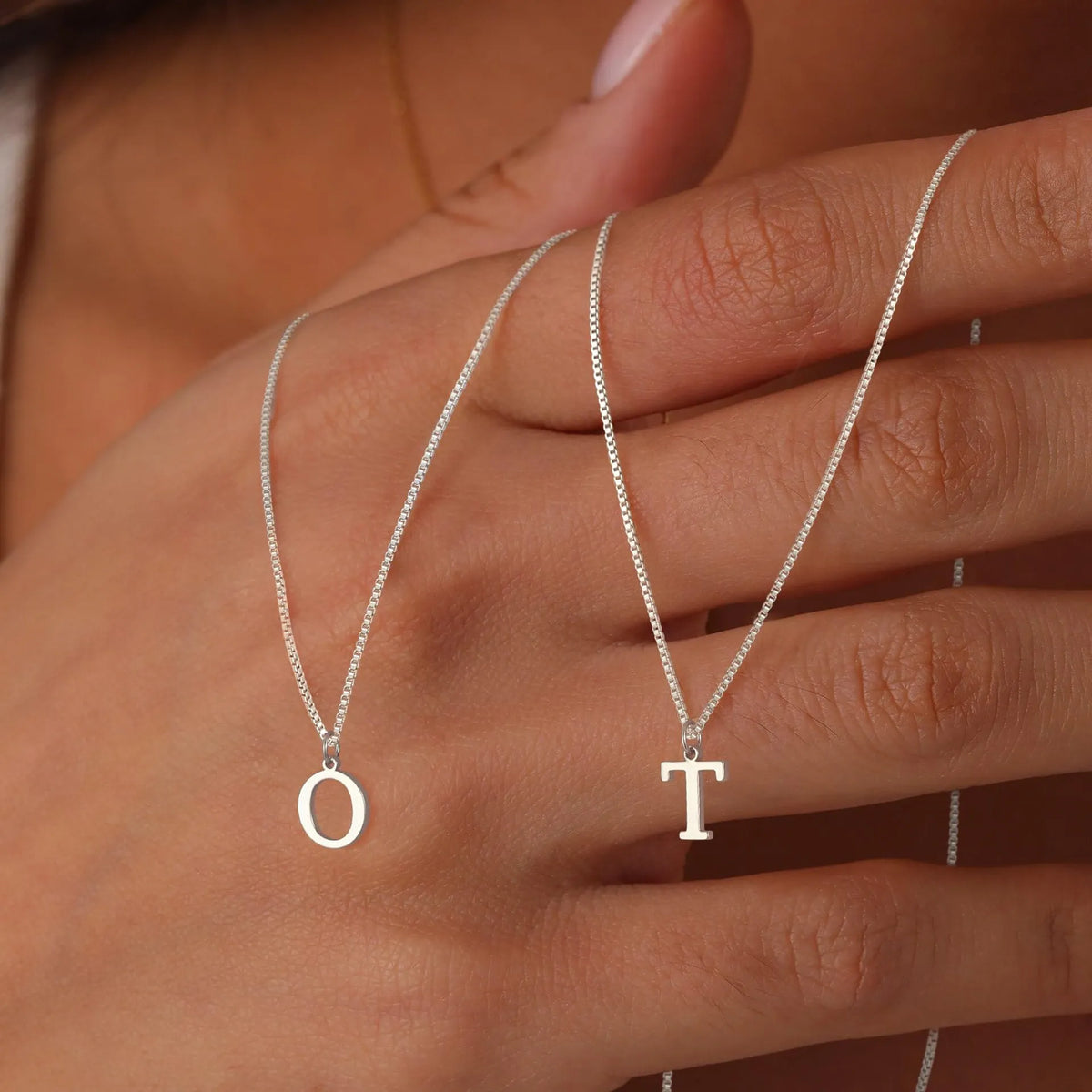 Explore a 26-piece A–Z initial necklace set in gold-tone and silver-tone stainless steel, ready for boutiques, gift shops and jewelry retailers.