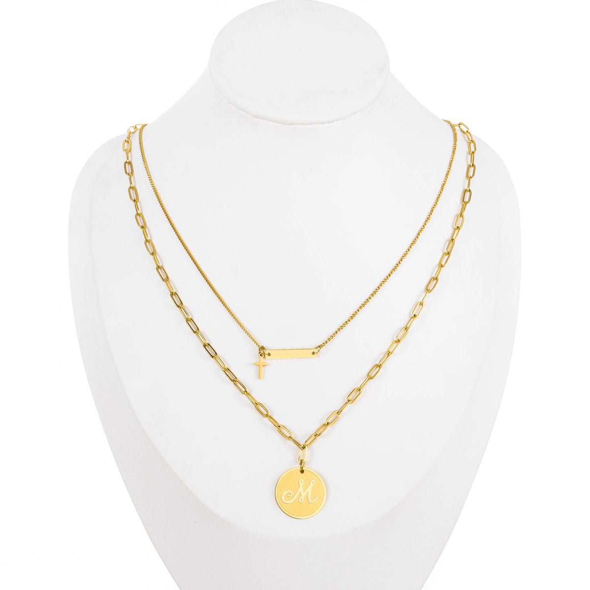 Dainty gold-tone layered necklace sets featuring delicate chains, pendants, and charms. Choose from multiple styles for an effortless stacked look.
