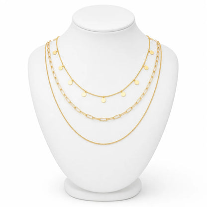 Dainty gold-tone layered necklace sets featuring delicate chains, pendants, and charms. Choose from multiple styles for an effortless stacked look.