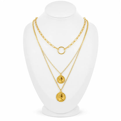 Dainty gold-tone layered necklace sets featuring delicate chains, pendants, and charms. Choose from multiple styles for an effortless stacked look.