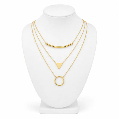 Dainty gold-tone layered necklace sets featuring delicate chains, pendants, and charms. Choose from multiple styles for an effortless stacked look.