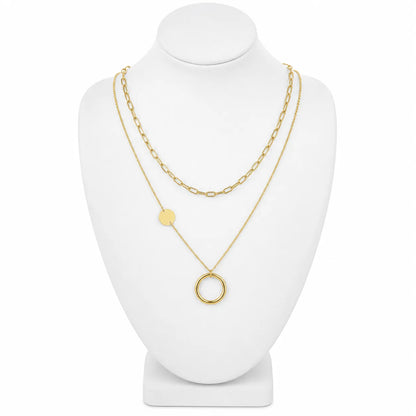 Dainty gold-tone layered necklace sets featuring delicate chains, pendants, and charms. Choose from multiple styles for an effortless stacked look.