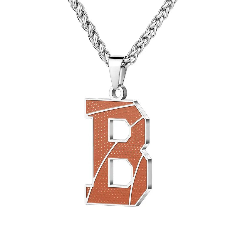 A curated collection of basketball-textured initial letter necklaces designed for wholesale buyers. Featuring a detailed basketball-grain finish on a stainless steel pendant and matching chain. 
