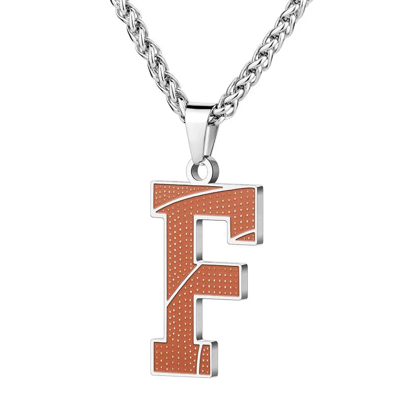 A curated collection of basketball-textured initial letter necklaces designed for wholesale buyers. Featuring a detailed basketball-grain finish on a stainless steel pendant and matching chain.