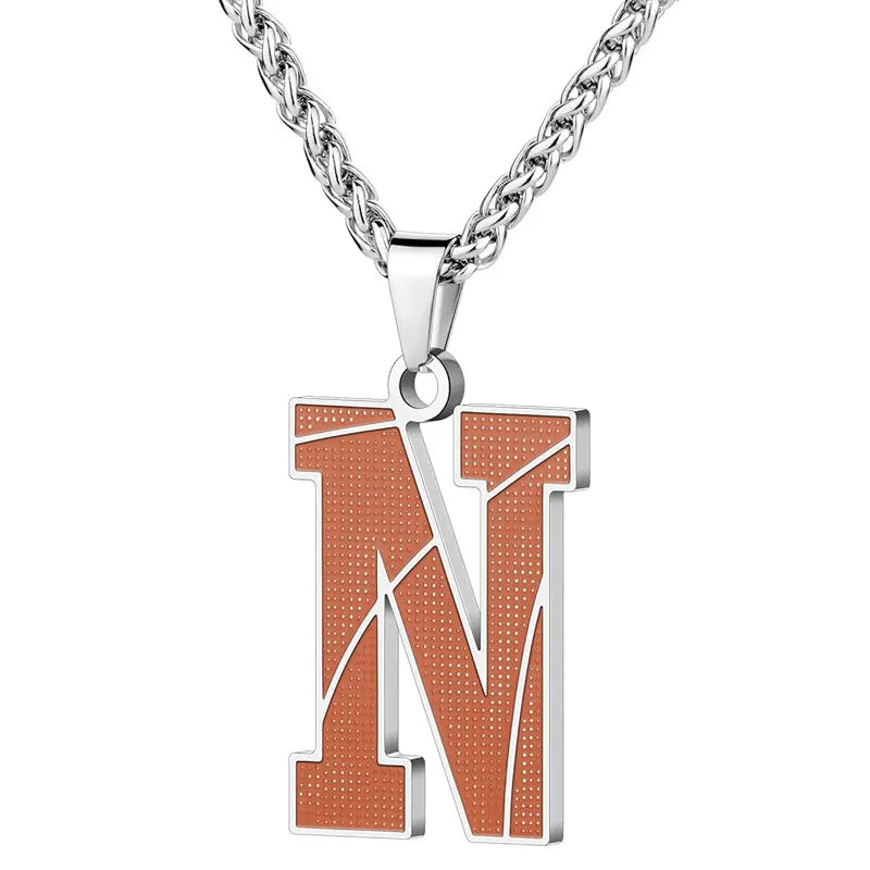 A curated collection of basketball-textured initial letter necklaces designed for wholesale buyers. Featuring a detailed basketball-grain finish on a stainless steel pendant and matching chain. 
