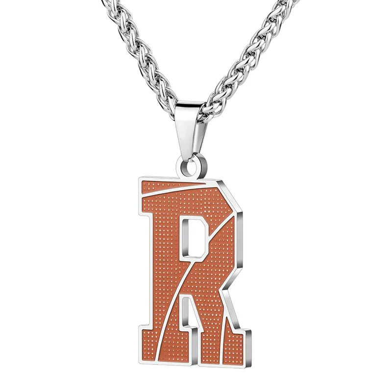 A curated collection of basketball-textured initial letter necklaces designed for wholesale buyers. Featuring a detailed basketball-grain finish on a stainless steel pendant and matching chain. 