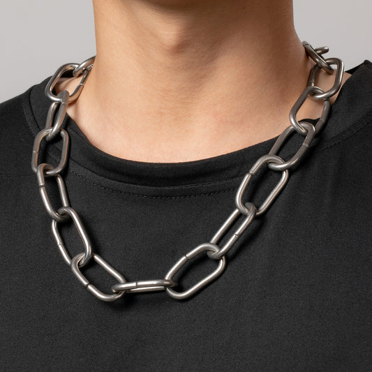 Professional male model wearing a black top with a HAWSON Chunky Punk Oval Cable Chain Link Necklace