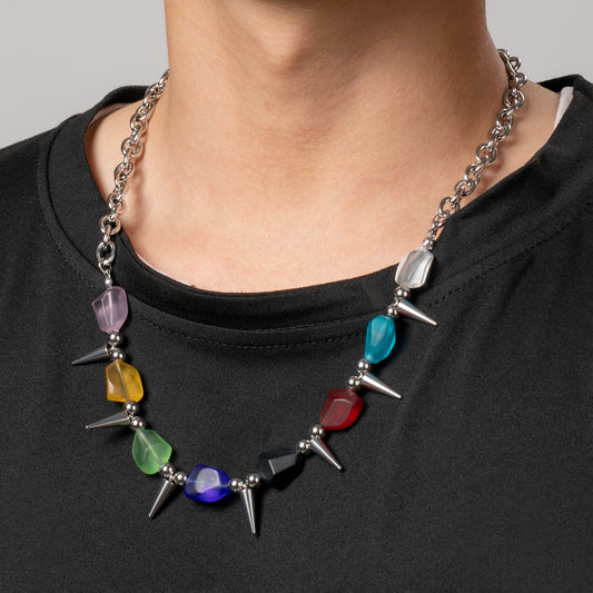 Professional male model wearing a black top with a HAWSON colorful beaded with spike rivet punk necklace