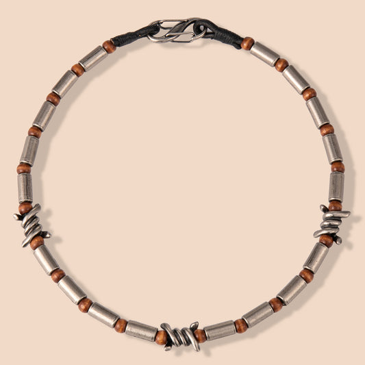 HAWSON cylindrical barrel necklace with tiger eye beads and oxidized stainless steel wire, merging industrial design with natural elements