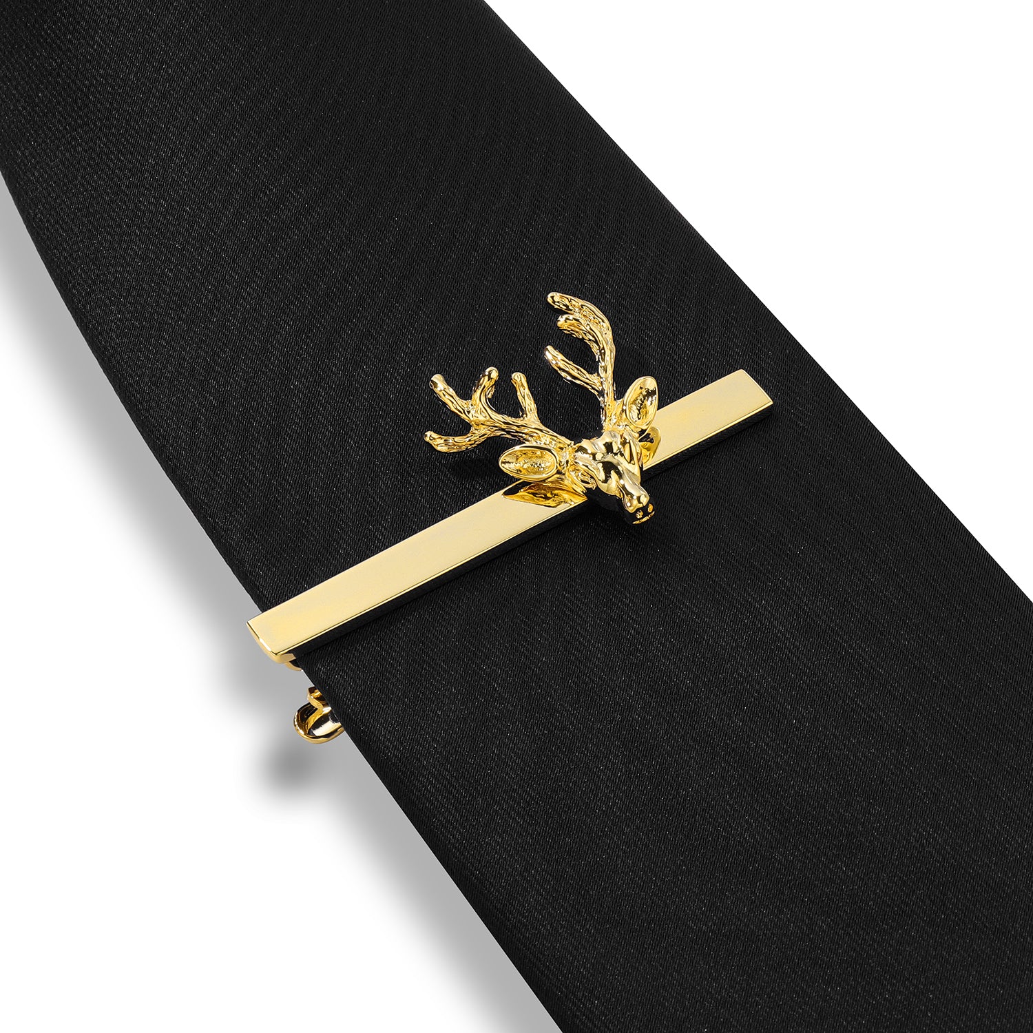 Brass gold stag antler tie clip displayed on a solid black necktie.
