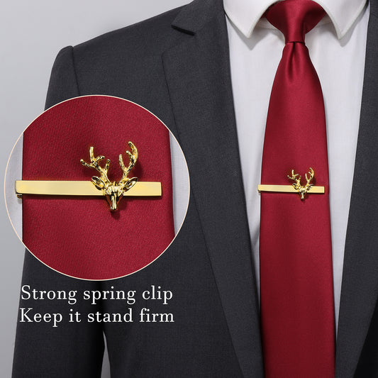 Close-up of the brass gold deer head tie clip on a red necktie.