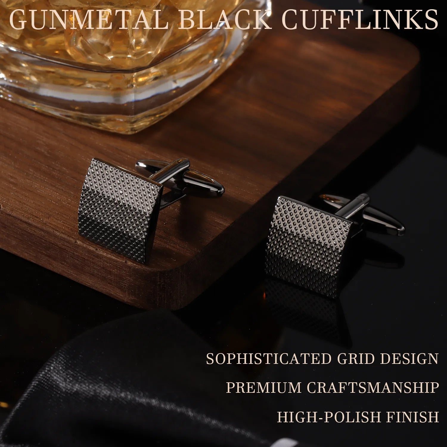 Pair of gunmetal grid cufflinks displayed on wooden surface with premium finish