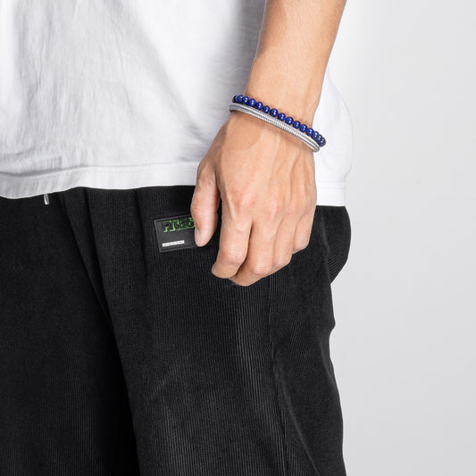 Professional man wearing HAWSON heavyweight leather cuff bracelet - masculine jewelry for office or evening wear