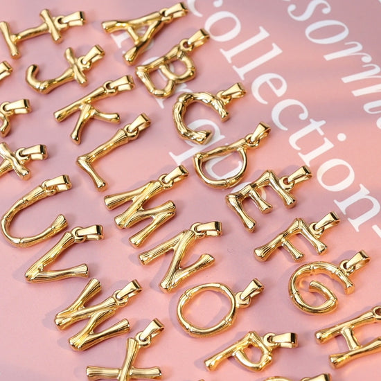 A-Z gold-tone letter pendant necklace collection showing assorted alphabet initials