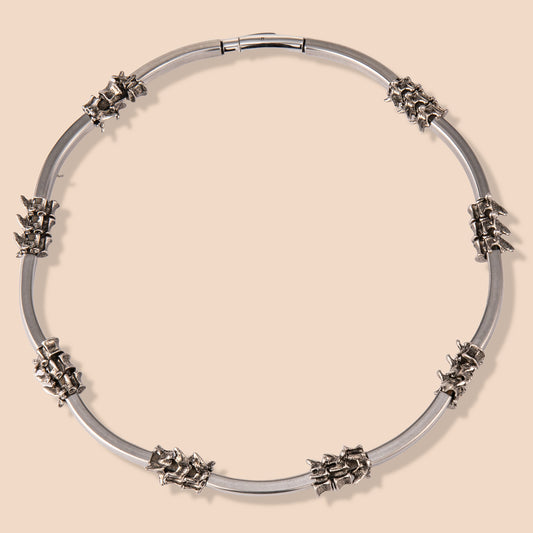 HAWSON vertebrae chain necklace with hand-distressed stainless steel spine links, blending Victorian medical aesthetics with punk edge